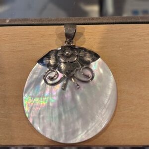 Vintage mother of pearl shell and sterling silver pendant